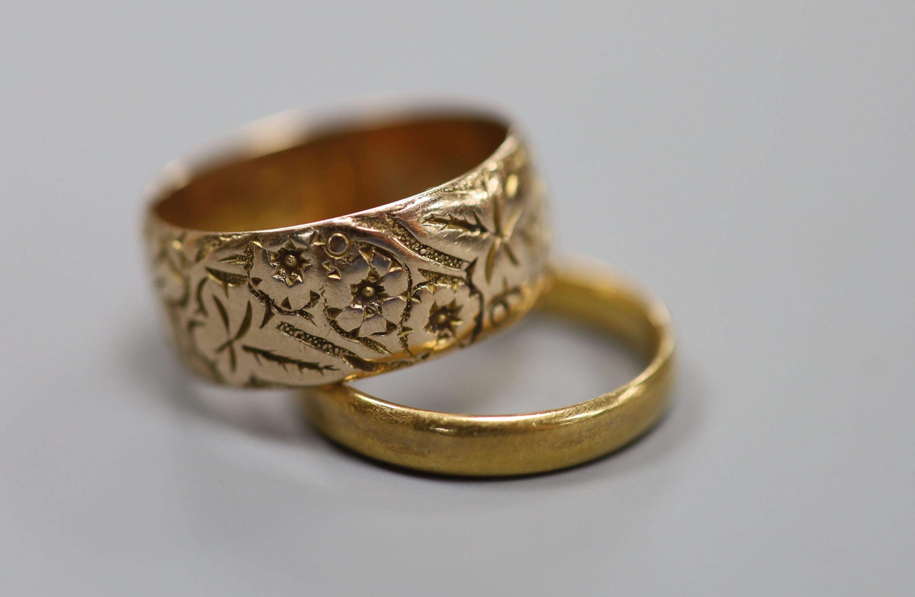 A 9ct gold wedding band, 4.5 grams and a 22ct gold wedding ring, 3.3 grams.